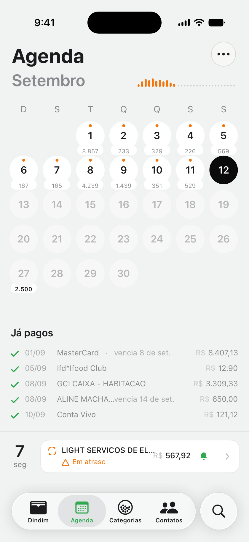 A Agenda de setembro: a grade do mês com o total gasto em cada dia, a lista do que já foi pago e uma conta de luz em atraso.